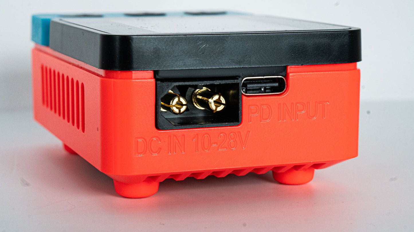 Red electronic device with connectors on a white background